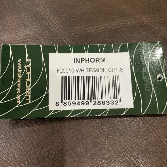 Brand new white Inphorm tennis skirt with pockets. Navy stripes down each side. - Picture 4 of 4